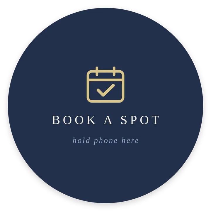 Round sticker: book a spot, hold phone here