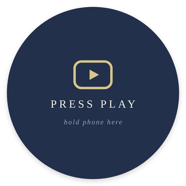 Round sticker: press play, watch on youtube, hold phone here